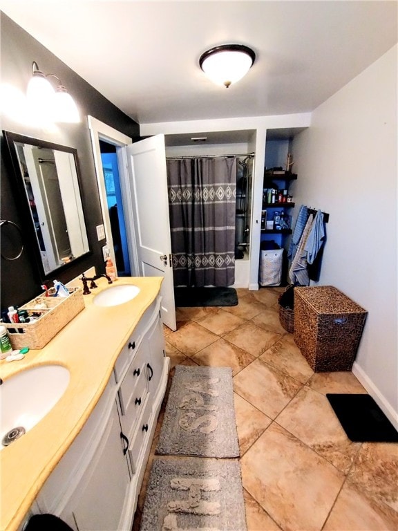 bathroom with tile patterned flooring and vanity