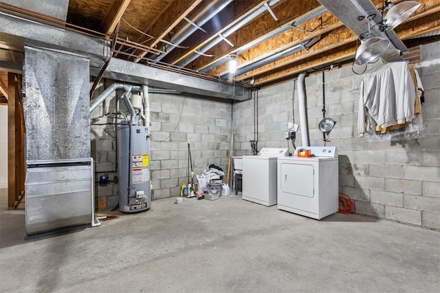 basement featuring separate washer and dryer and water heater