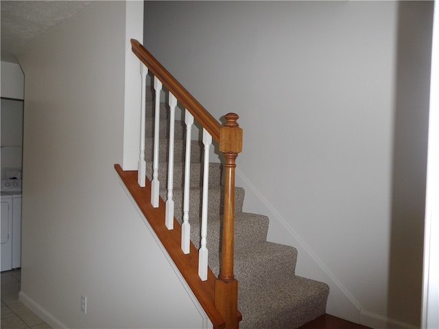 staircase with tile patterned floors