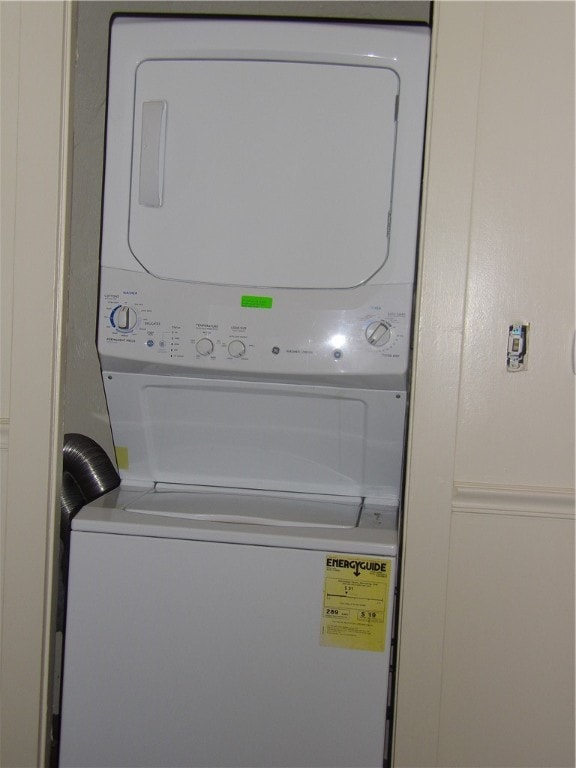 washroom featuring stacked washer and dryer