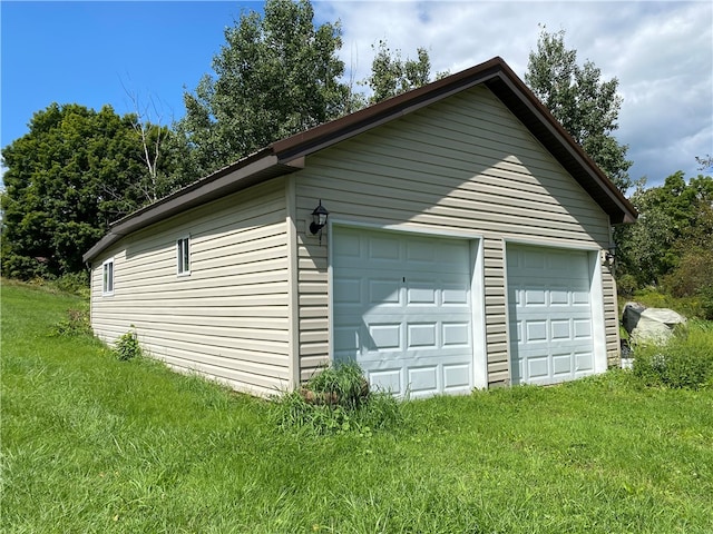 garage featuring a yard