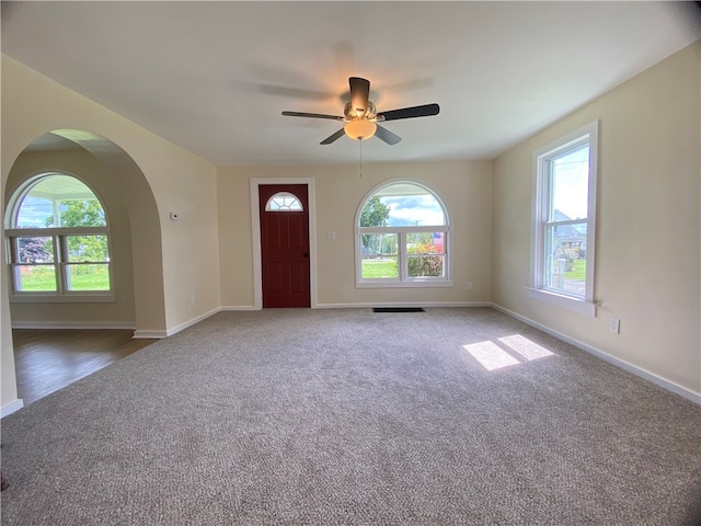 interior space featuring a wealth of natural light and ceiling fan