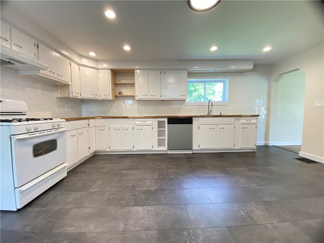 kitchen with decorative backsplash, white cabinets, dishwasher, dark tile patterned flooring, and white range with gas cooktop