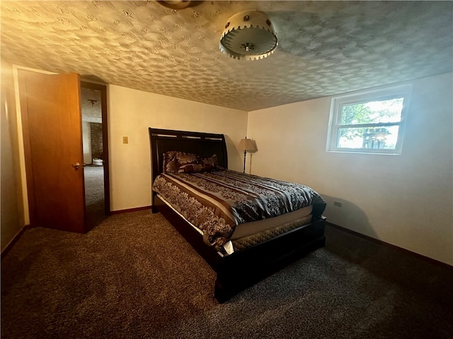 carpeted bedroom featuring a textured ceiling