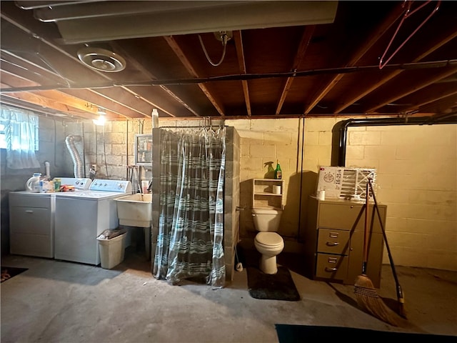 basement with sink and washer and clothes dryer