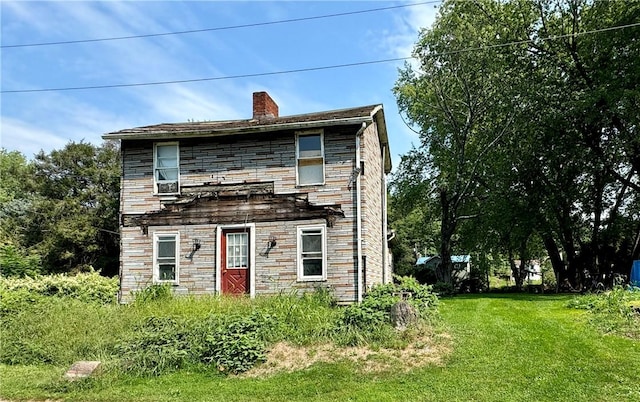 1210 Wysocki Ave 1206, 1207, North Apollo, PA 15673 - view of front of property featuring stone siding, a front lawn, and a chimney
