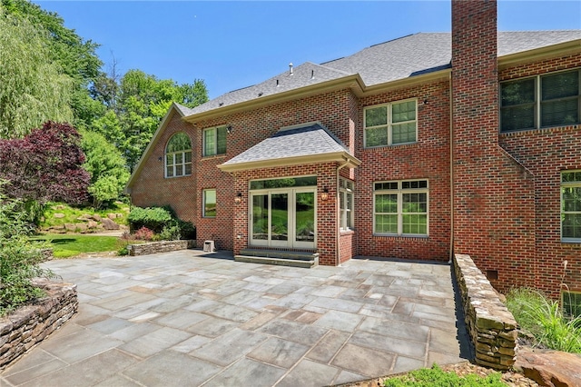 rear view of property featuring a patio