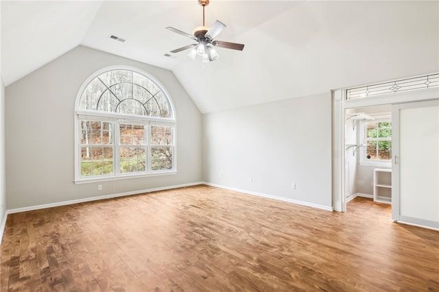 interior space featuring hardwood / wood-style flooring, plenty of natural light, ceiling fan, and lofted ceiling