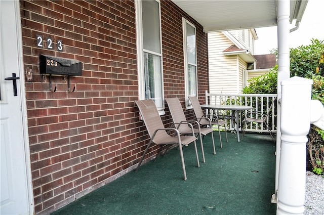 view of patio featuring a porch