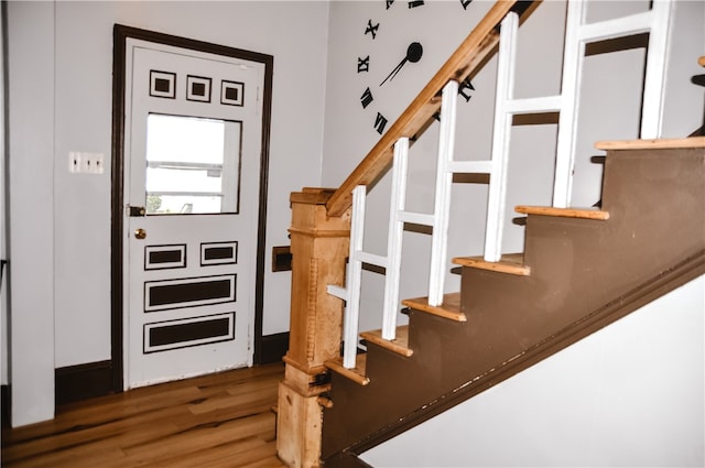 staircase featuring hardwood / wood-style floors