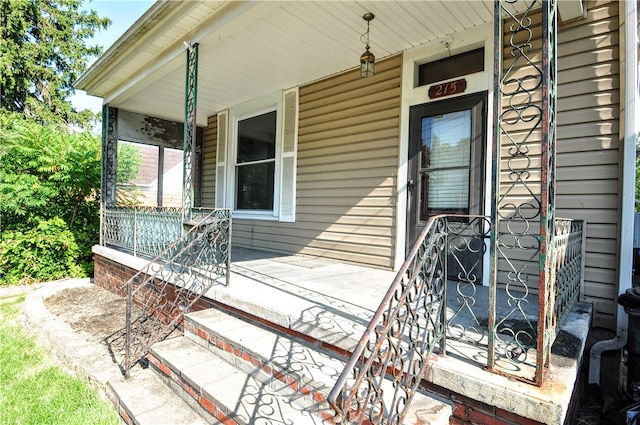 entrance to property featuring a porch