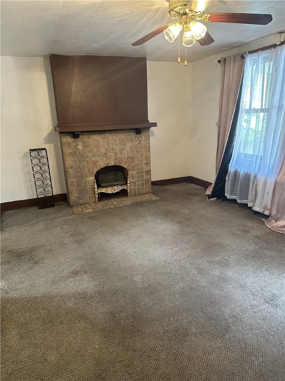 unfurnished living room with carpet floors and ceiling fan