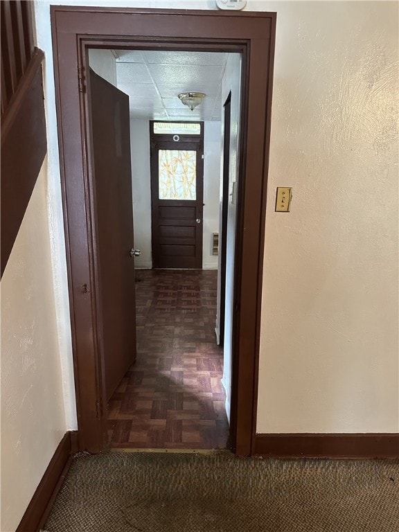 hallway with dark parquet floors