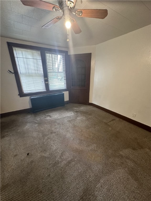 unfurnished bedroom featuring ceiling fan and carpet flooring