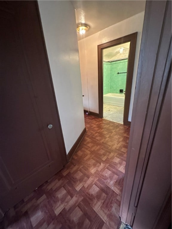 hall with dark parquet flooring