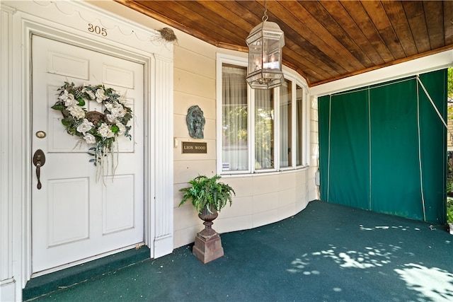 doorway to property with a porch