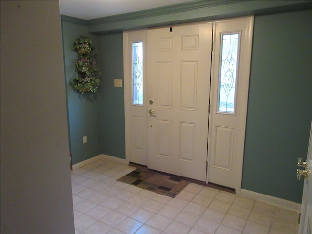 tiled foyer with crown molding