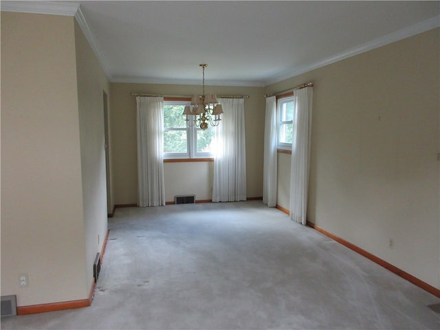 unfurnished dining area with a wealth of natural light, crown molding, and a chandelier