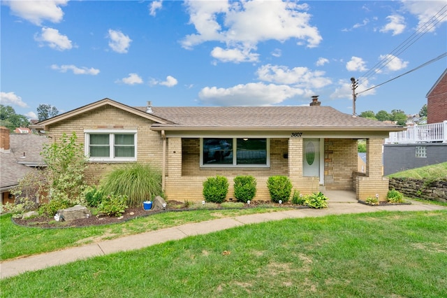 ranch-style home with a front lawn