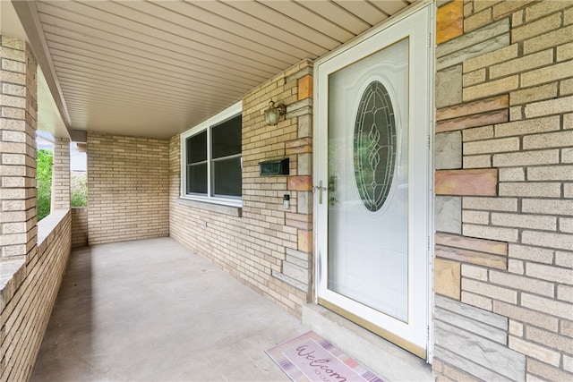 doorway to property with a porch