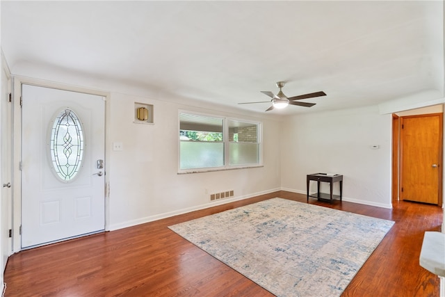 foyer with ceiling fan and dark wood-type flooring