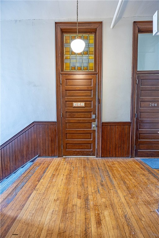 entryway with wood-type flooring