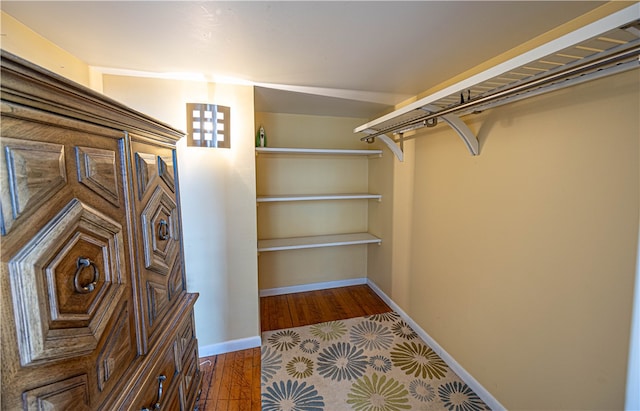 spacious closet featuring hardwood / wood-style flooring