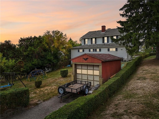 view of outdoor structure featuring driveway