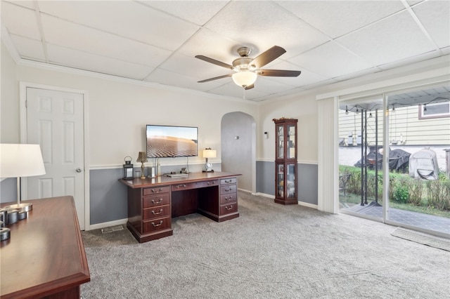 office area with ceiling fan, a drop ceiling, and light carpet