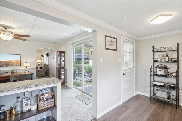 interior space with ceiling fan, access to exterior, and dark wood-type flooring