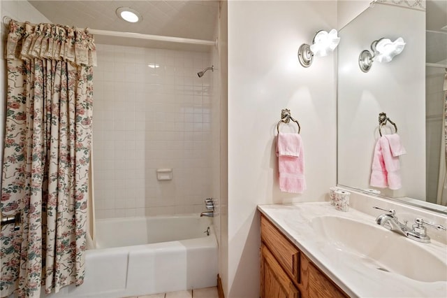 bathroom with shower / tub combo and vanity