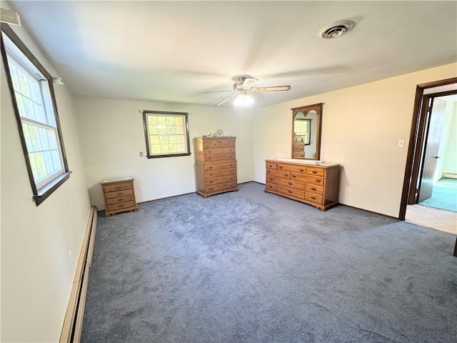 unfurnished bedroom featuring carpet, ceiling fan, and a baseboard radiator