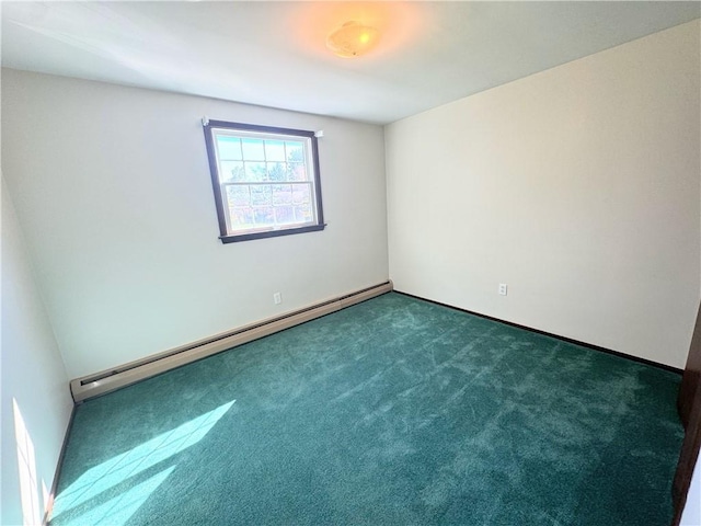 unfurnished room featuring dark colored carpet and a baseboard heating unit