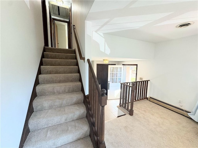 staircase with carpet floors and baseboard heating