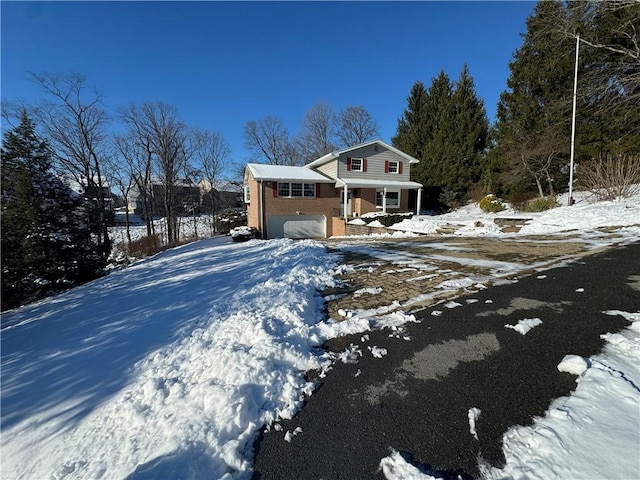 view of front of house with a porch and a garage