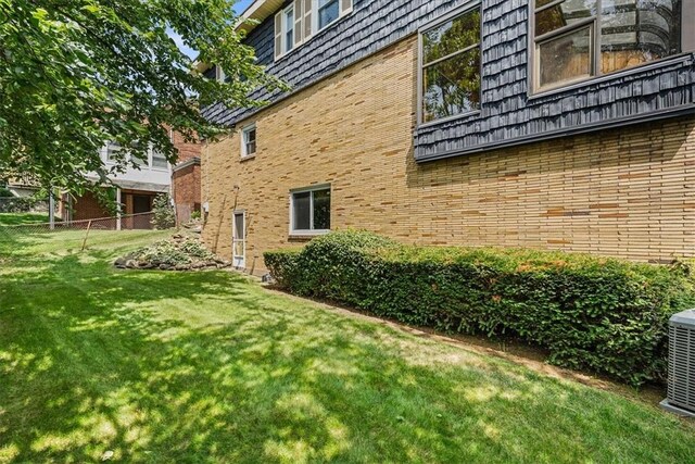 view of home's exterior featuring a lawn