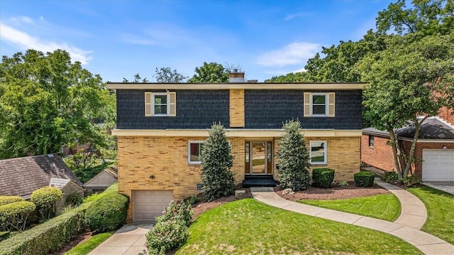 view of front of home with brick siding, mansard roof, a chimney, a garage, and driveway