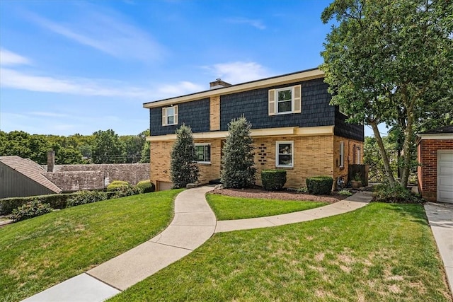 view of front of house with mansard roof, a front yard, a garage, brick siding, and a chimney