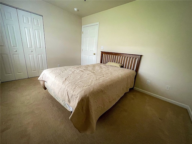 carpeted bedroom with a closet