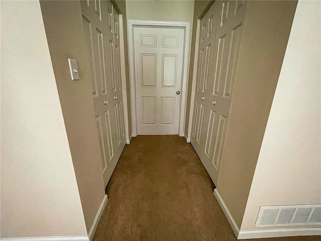 hallway featuring carpet