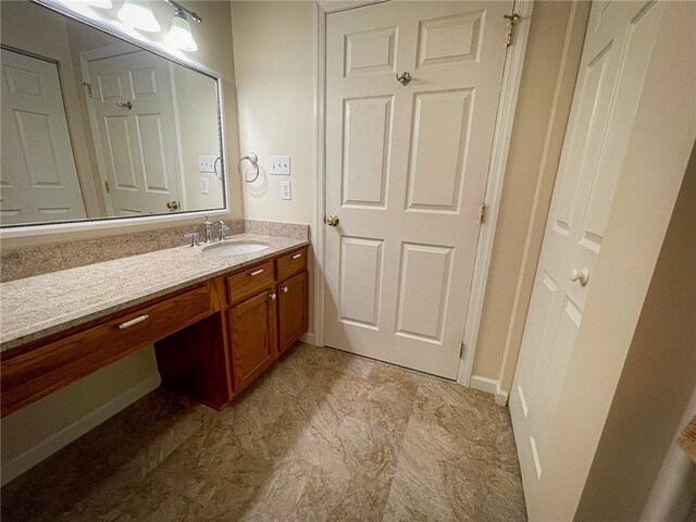 bathroom with vanity and tile patterned flooring