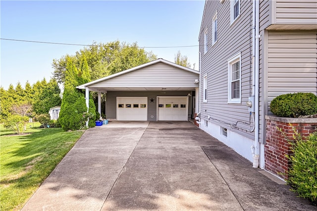 garage featuring a lawn