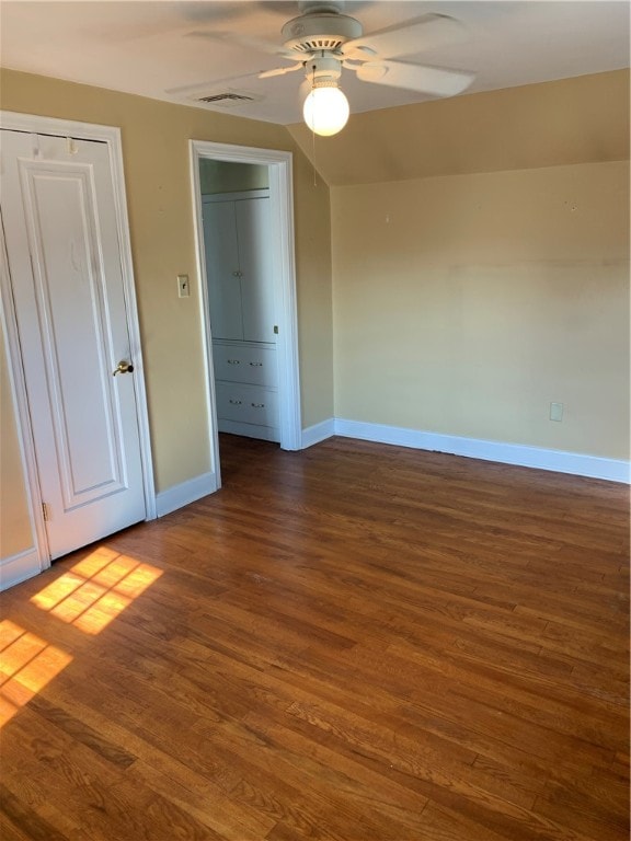 unfurnished room featuring ceiling fan and dark hardwood / wood-style floors