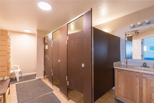 bathroom featuring vanity and tile patterned flooring