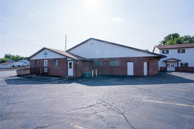 view of front of property featuring cooling unit