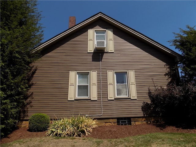 view of side of home with cooling unit