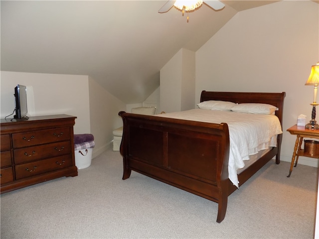 bedroom featuring vaulted ceiling, ceiling fan, and light colored carpet