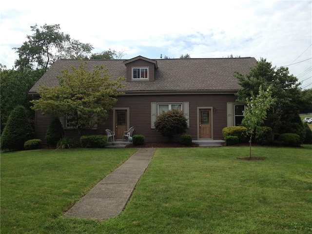 1216-1218 Clark St, White Oak, PA 15131 - cape cod house featuring a front yard and a shingled roof
