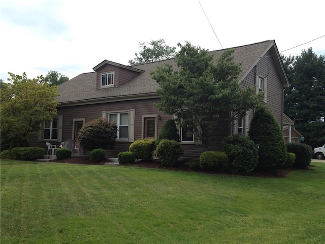 1216-1218 Clark St, White Oak, PA 15131 - cape cod house featuring a front lawn and a shingled roof