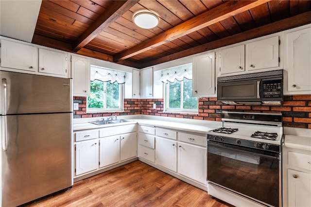 kitchen with wood ceiling, white gas stove, stainless steel fridge, and beam ceiling